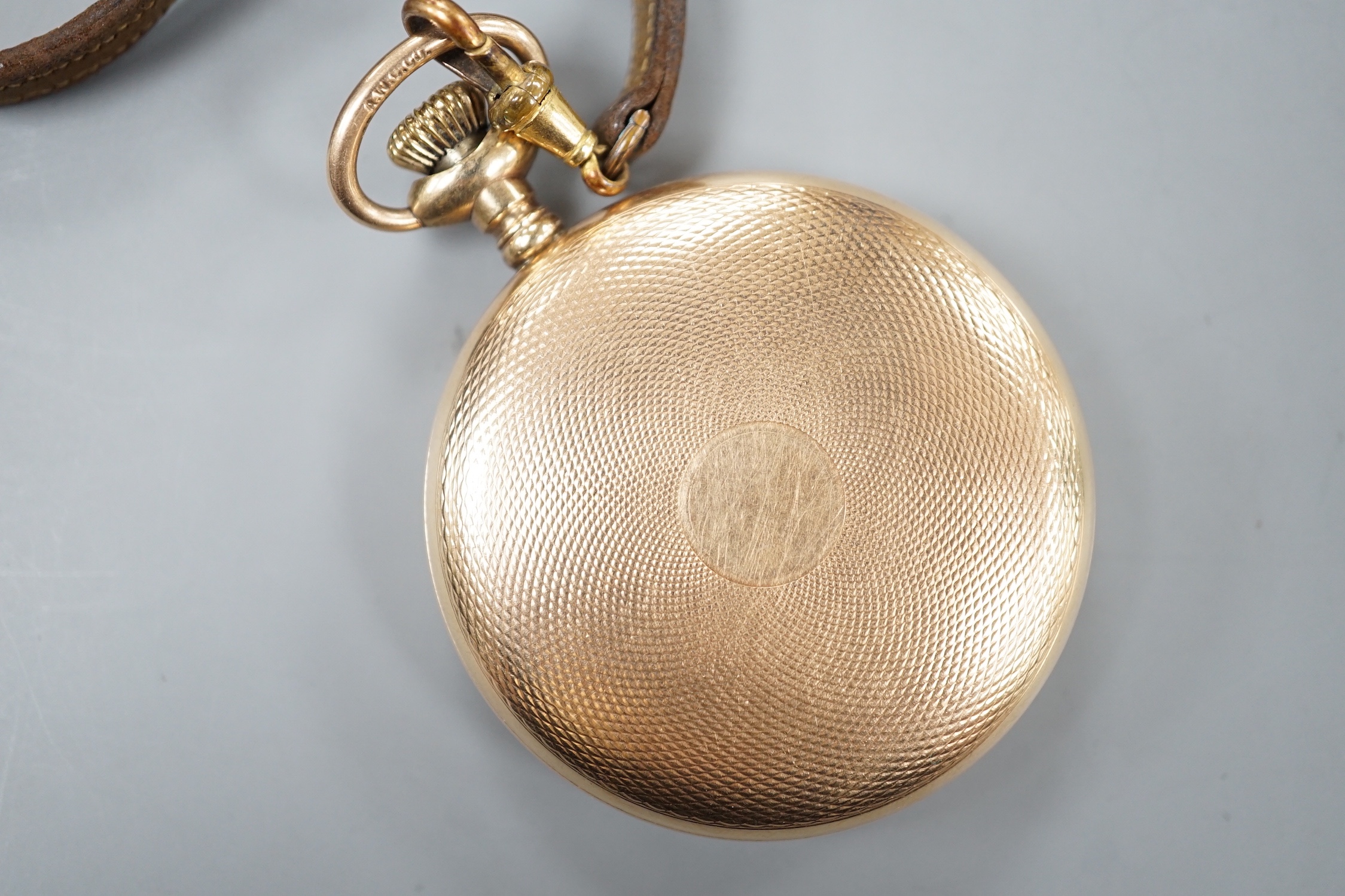 An engine turned gold plated keyless open faced pocket watch, by Rodger & Wright, case diameter 50mm.